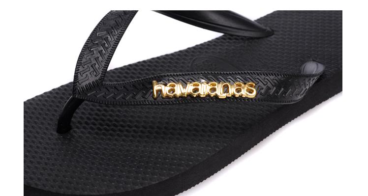 black havaianas with gold logo